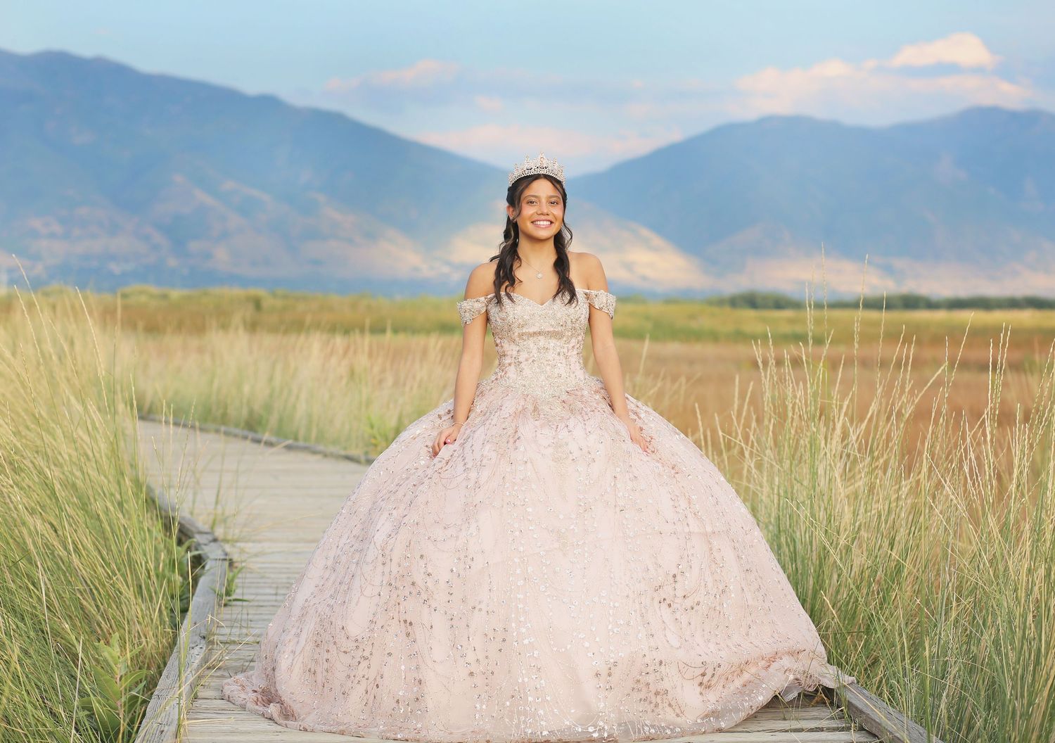 A collection of outdoor portrait photos with mountains and fields in the background.