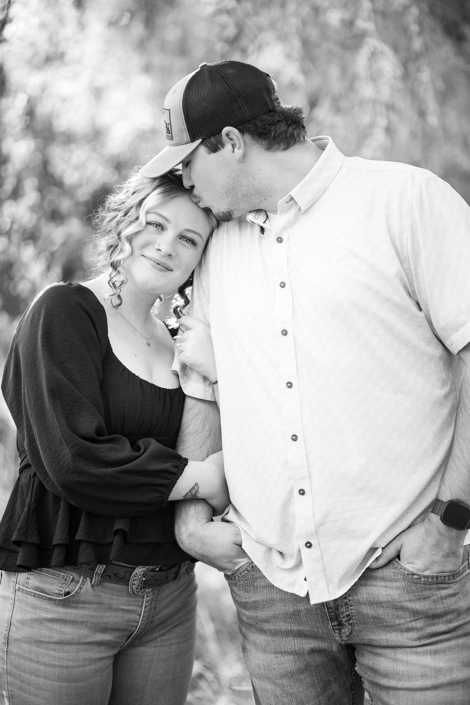 Black and white romantic portrait series showing tender moments between couple.