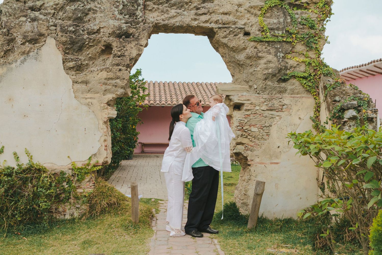 Parents with baptism boy at beautiful location, photo by Paula Brearley NYC baptism photographer