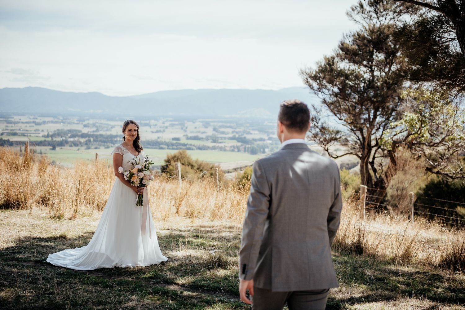 Outdoor elopement scene on scenic hilltop at Whitimanuka by August and Vine