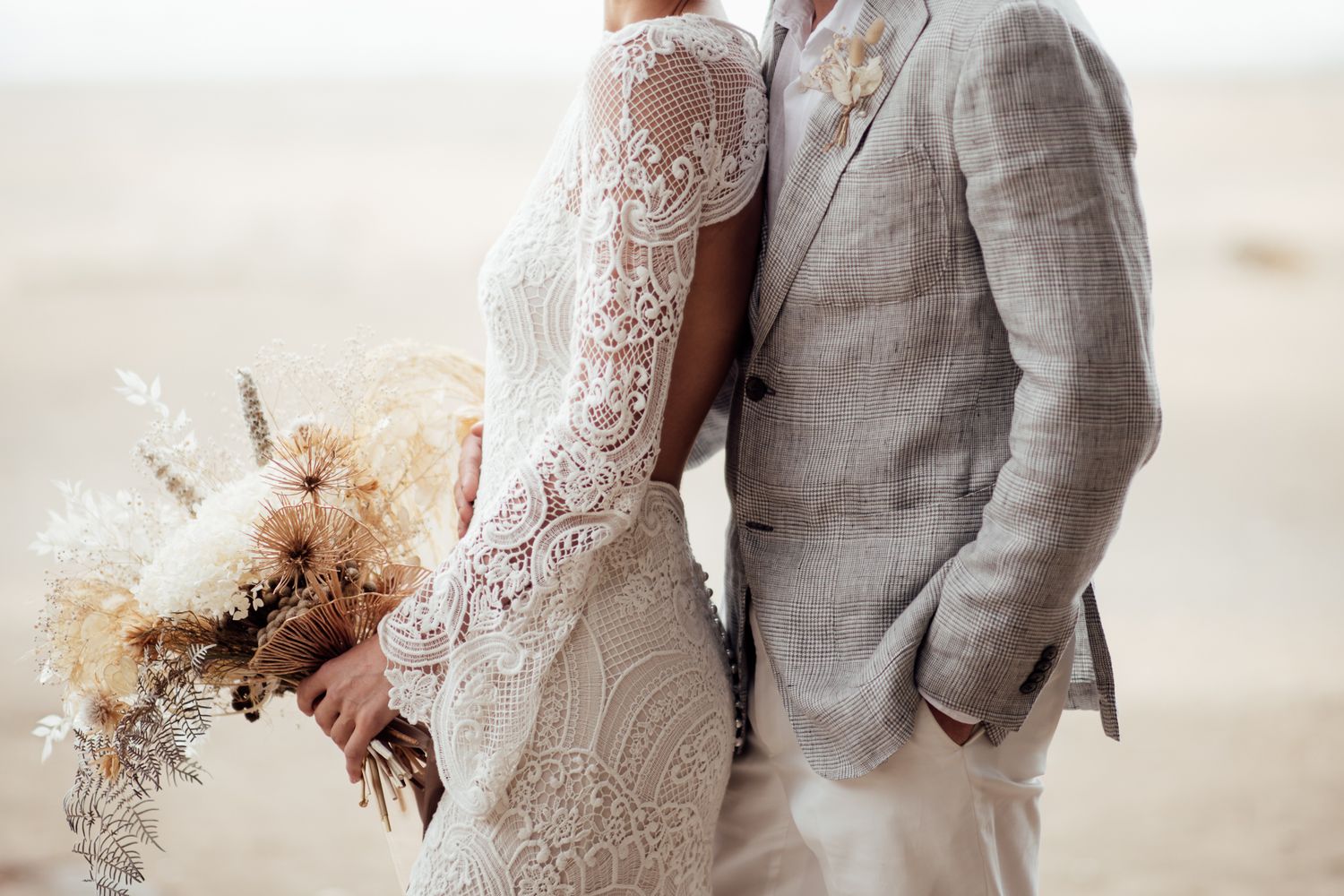 Close up of Bride and Groom standing side on one behind the other side on captured by August and Vine