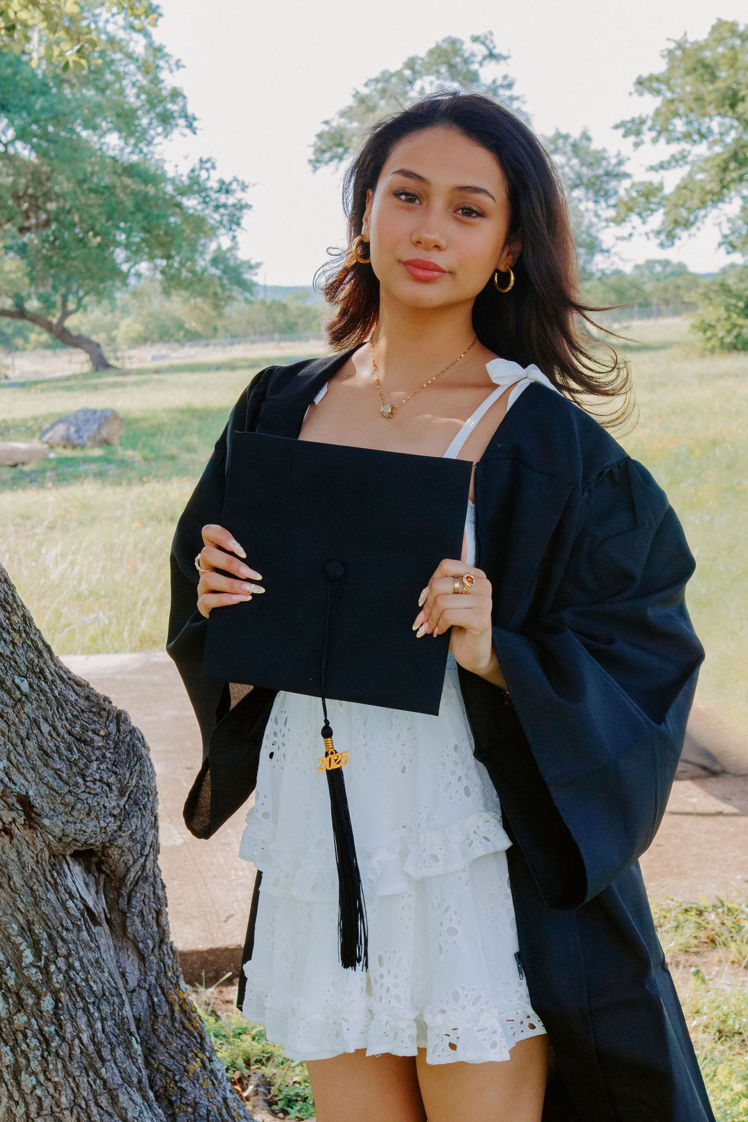 senior girl with cap and gown