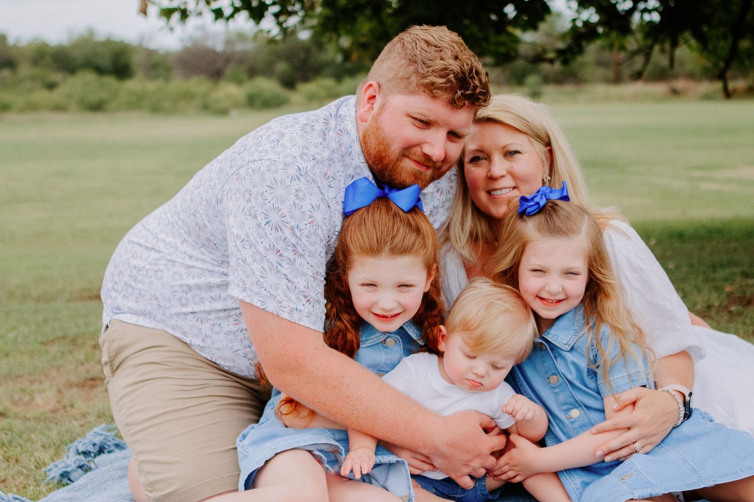 family tightly hugging each other