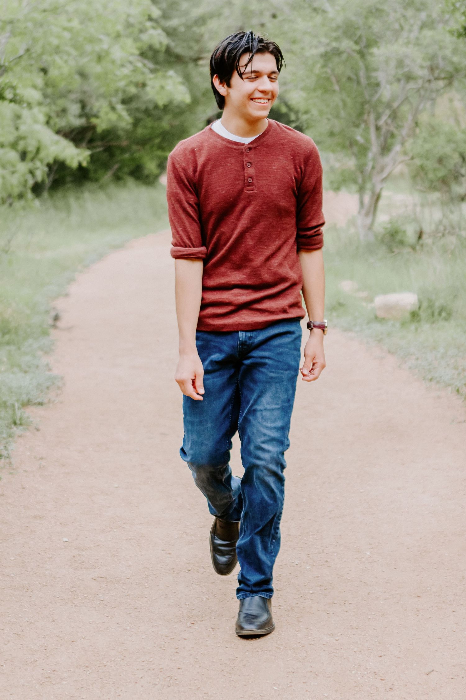 portrait of guy walking and smiling