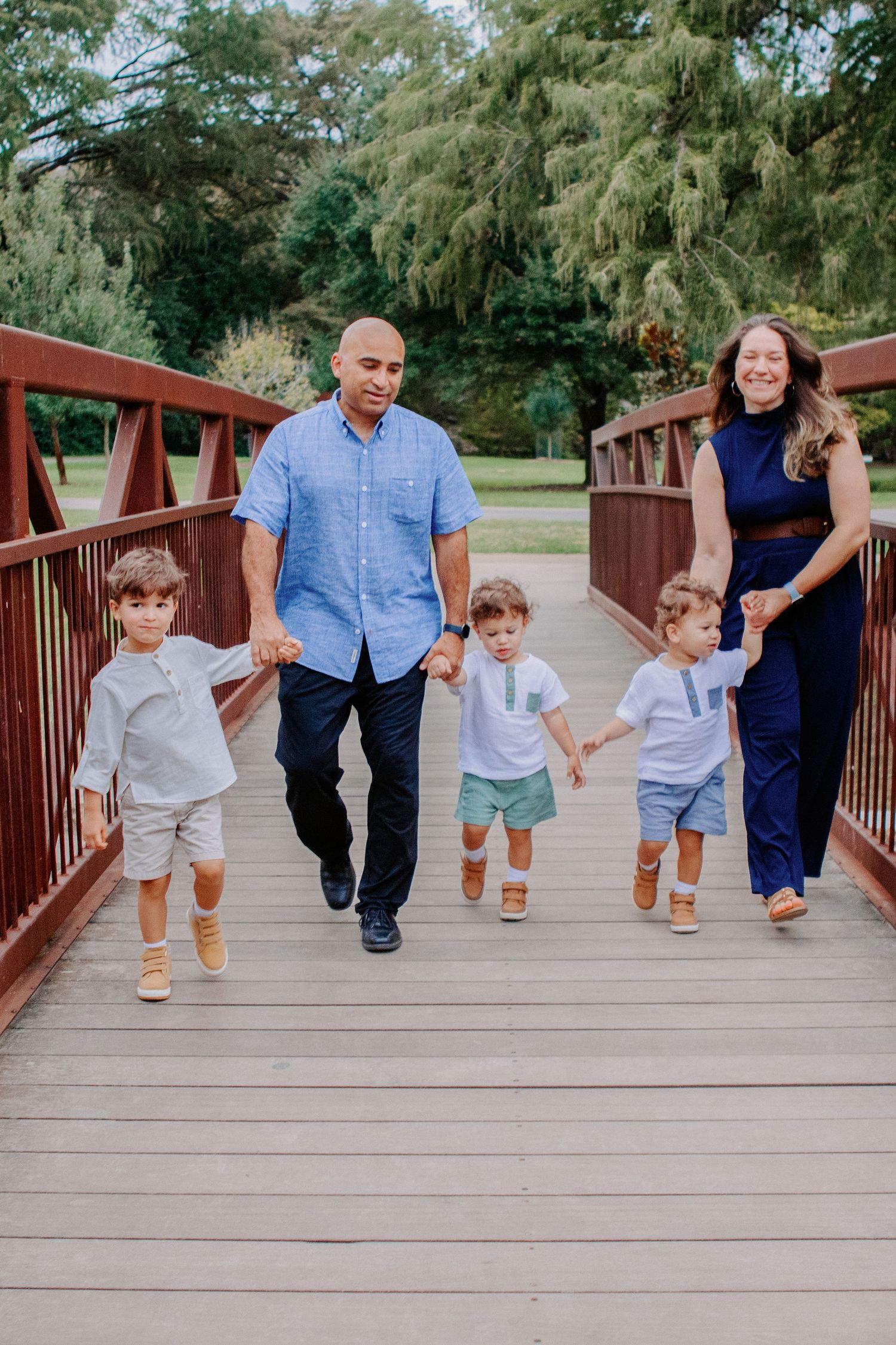 family walking on bridge