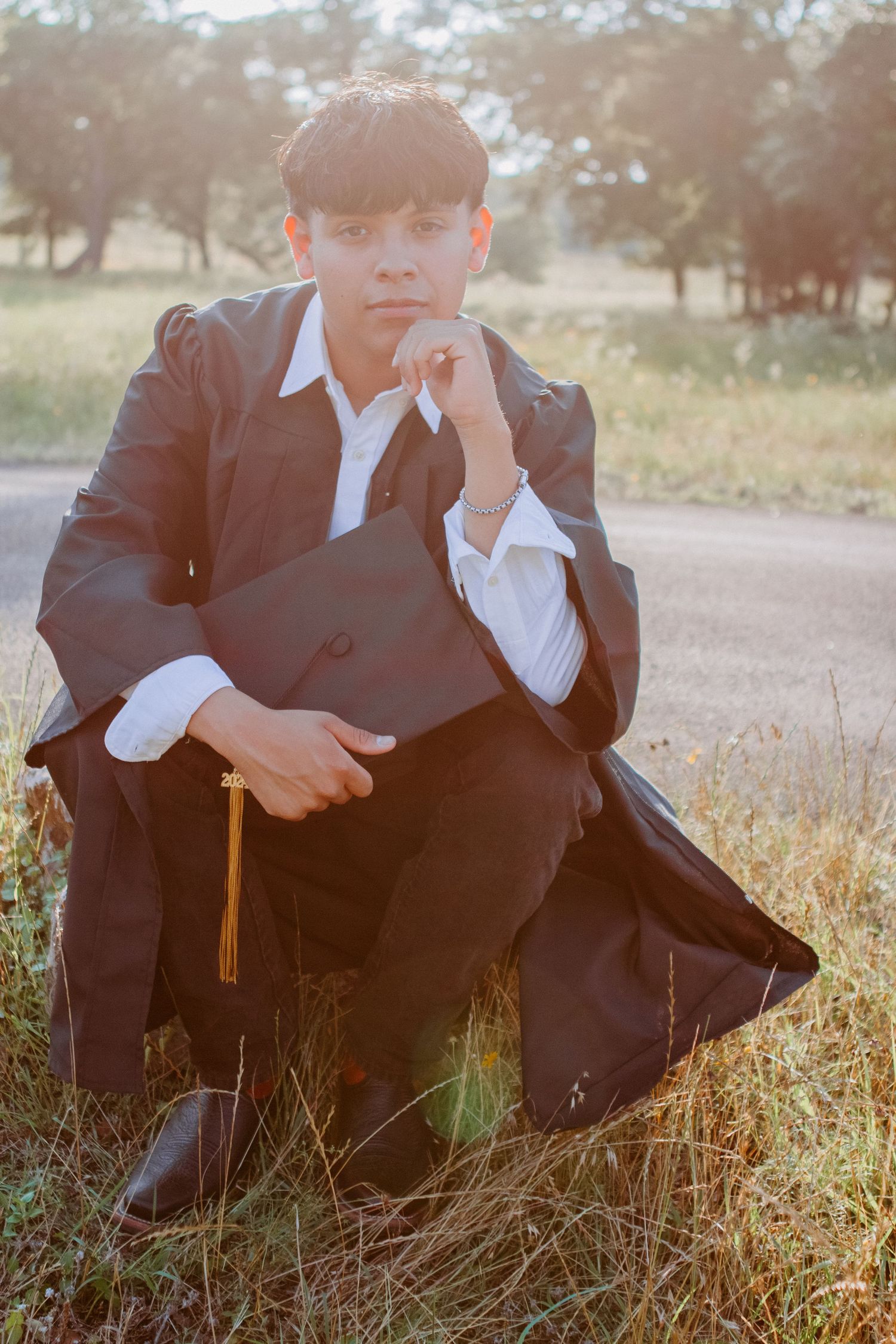 senior guy with cap and gown