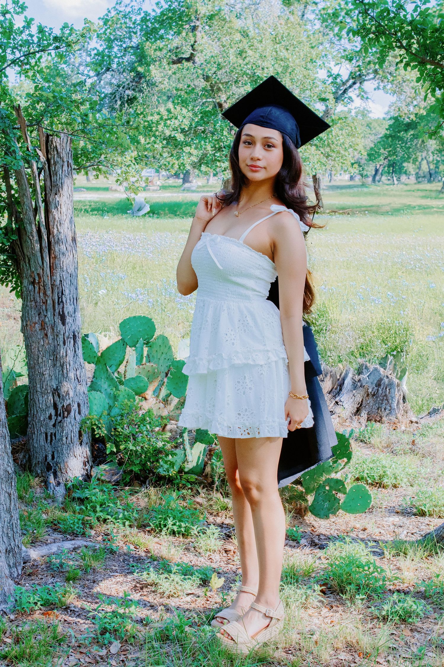 senior girl with her gap and gown