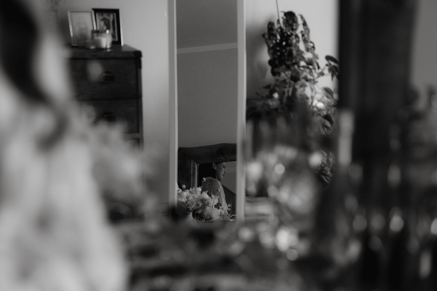 A blurred black and white interior scene with soft focus elements creating an artistic atmospheric effect.