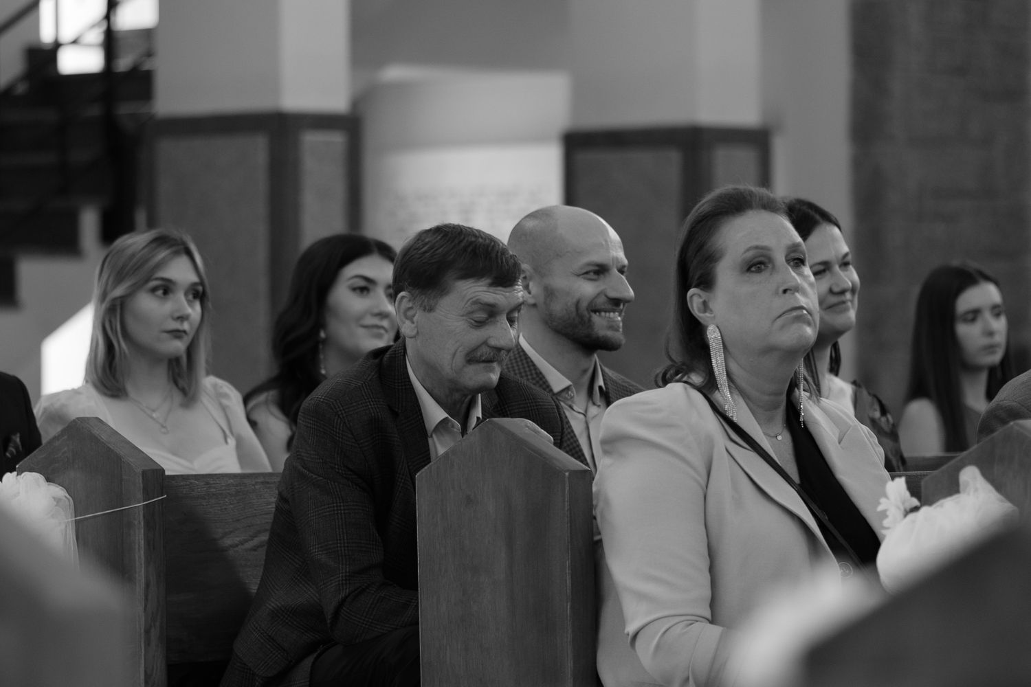 A group of attentive audience members seated in rows during what appears to be a formal indoor event or presentation.