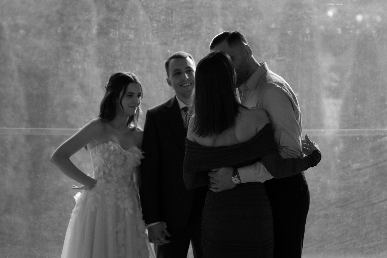 A black and white photo series showing couples dancing together in an intimate ballroom setting.