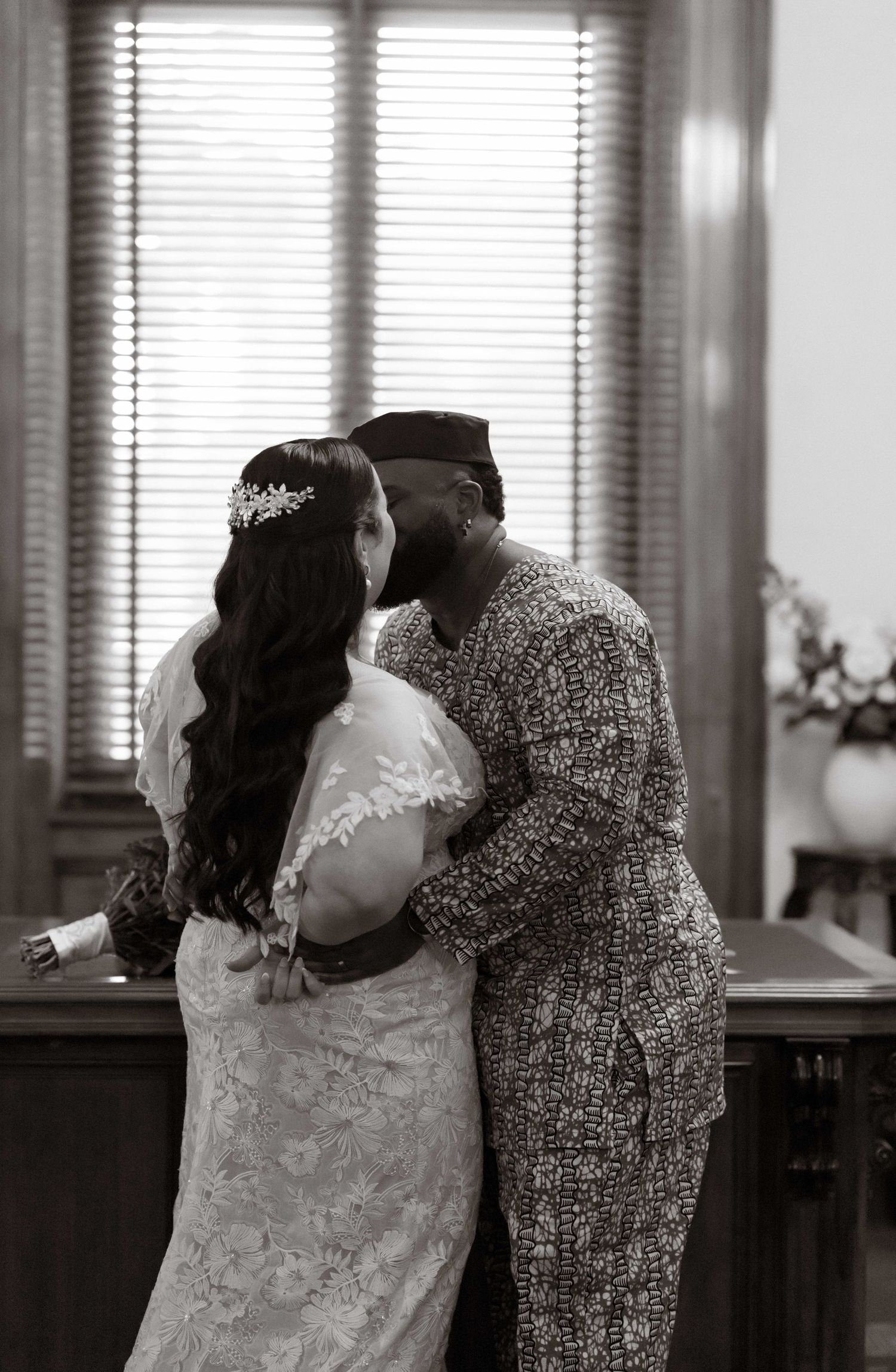 A romantic sequence of black and white photos showing a couple sharing tender kisses and intimate moments.