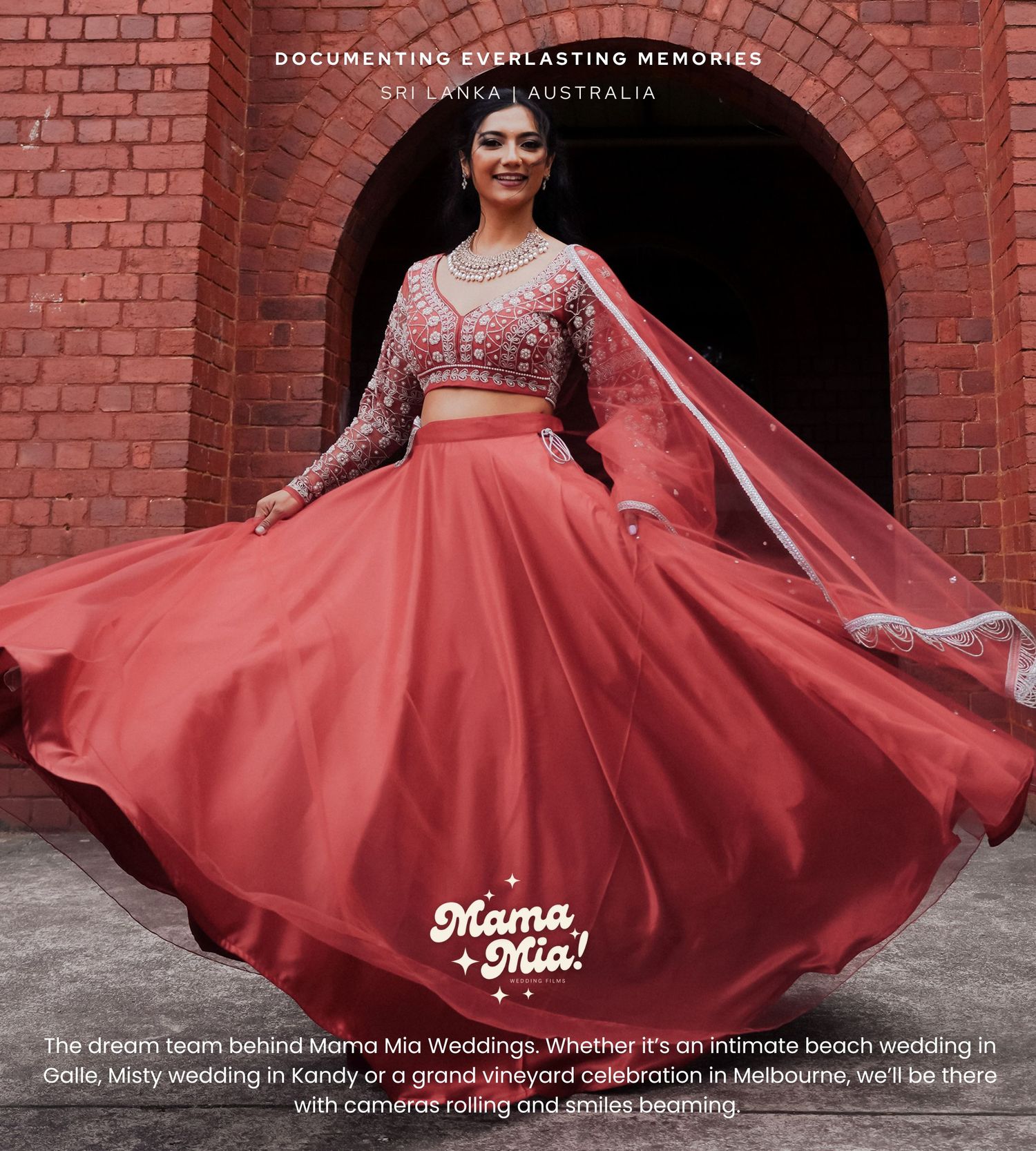 Traditional Indian wedding ensemble featuring a coral lehenga with embroidered crop top and flowing dupatta against brick archway.