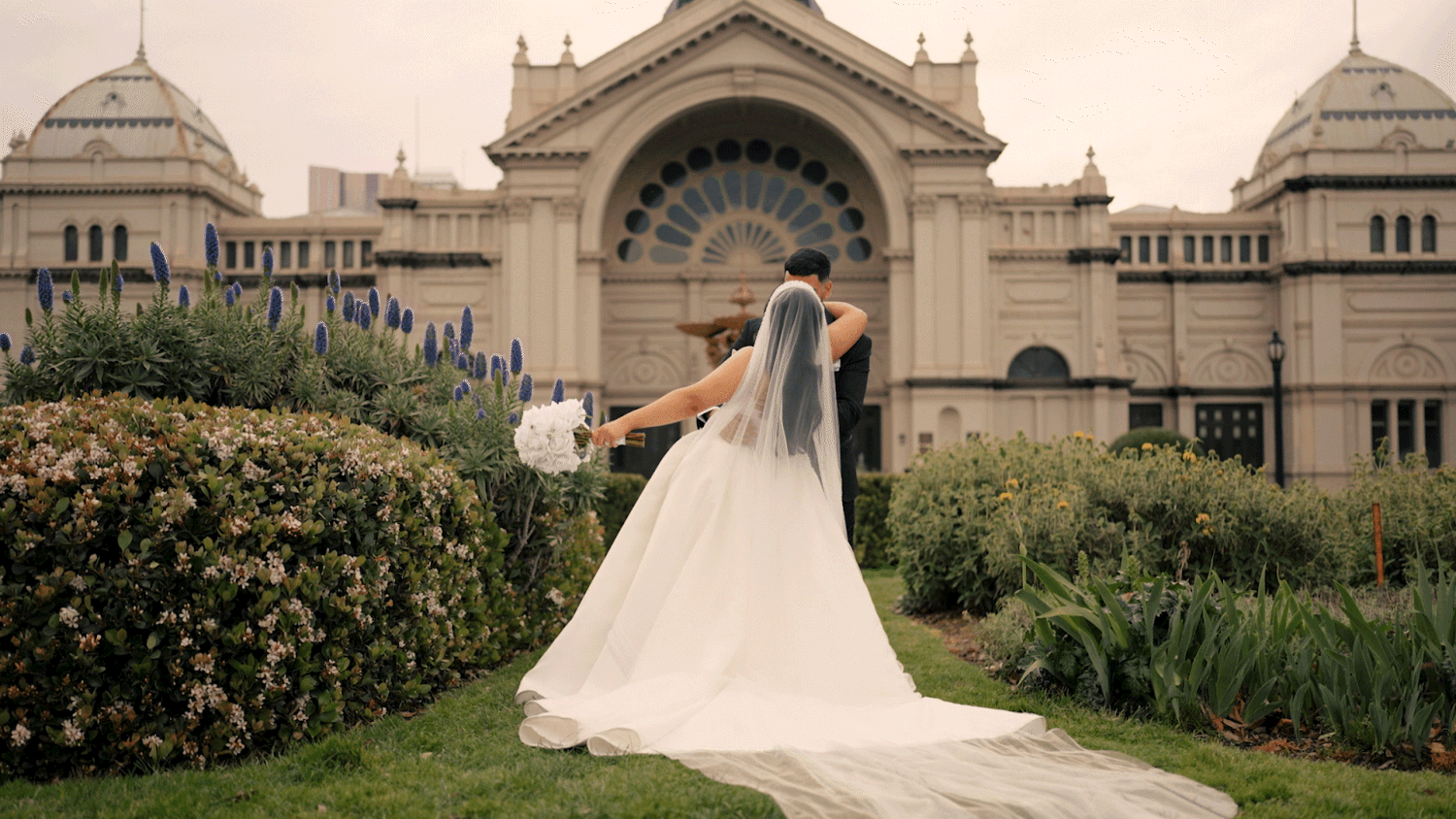 Royal Exhibition Building in Melbourne stands majestically with its ornate Victorian architecture and landscaped gardens.