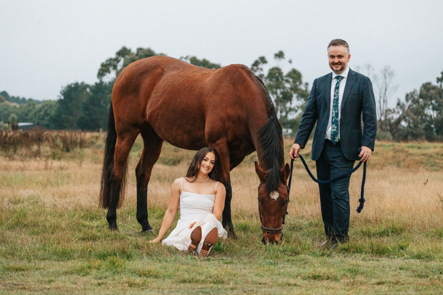 commercial. magazine ready. wife and husband sit together with their horse enjoying their moment