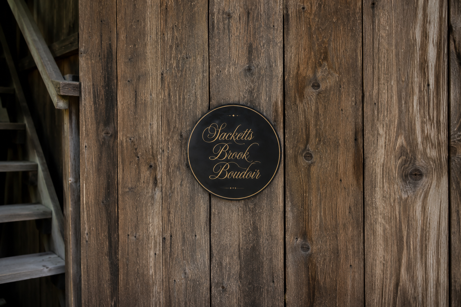 Sacketts Brook Boudoir sign mounted on rustic barn board siding at the Putney, Vermont studio.
