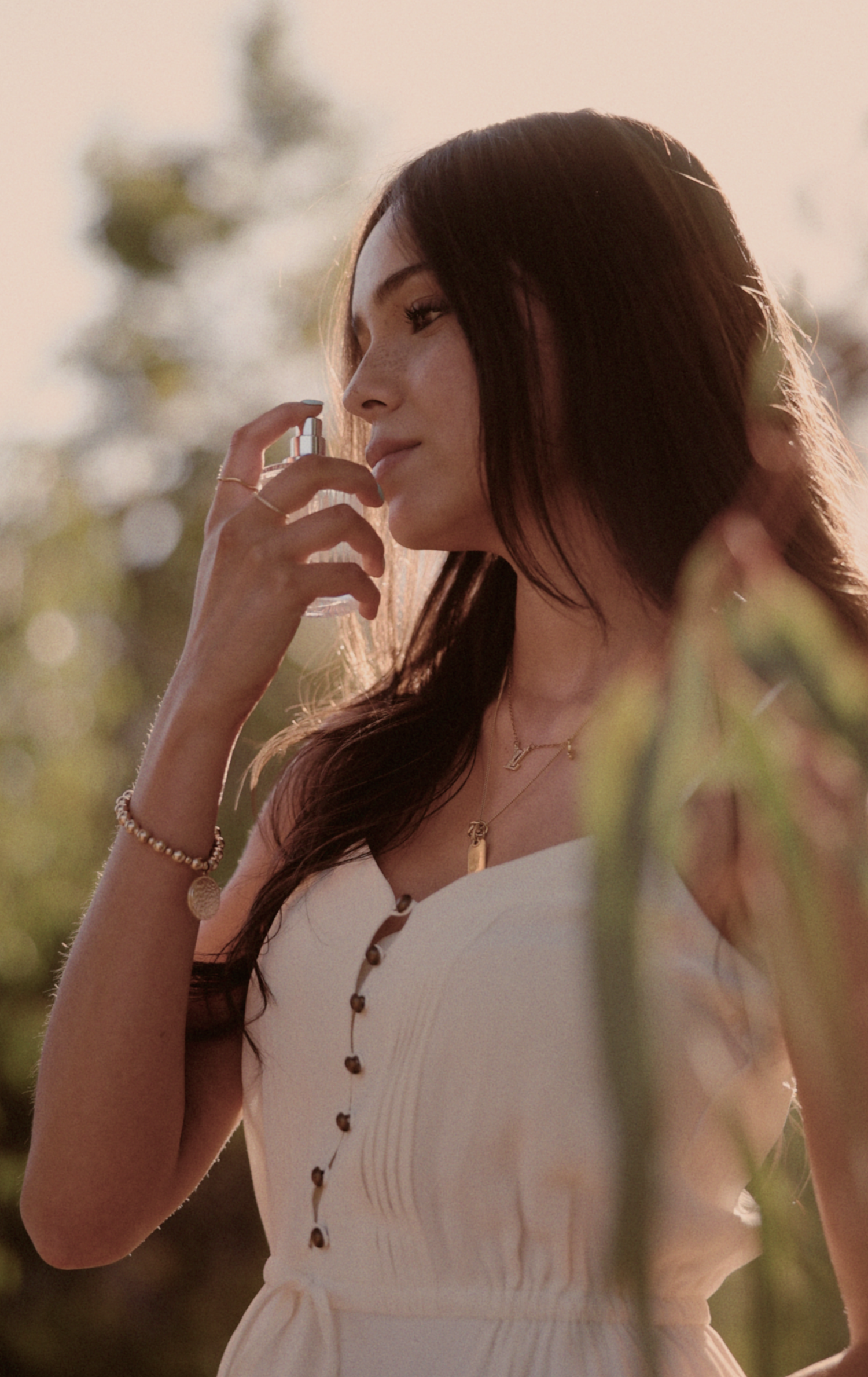 Brand storytelling photography for a beauty and wellness brand featuring a model experiencing a new fragrance.