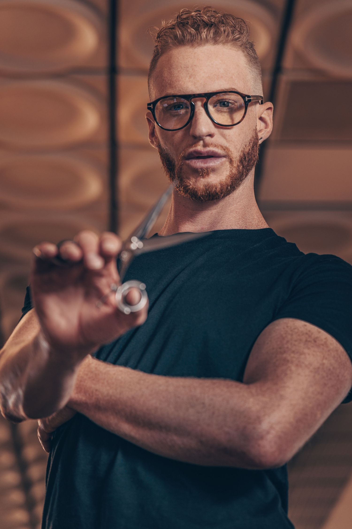 Editorial portrait of a creative professional photographed with cinematic lighting and atmosphere.