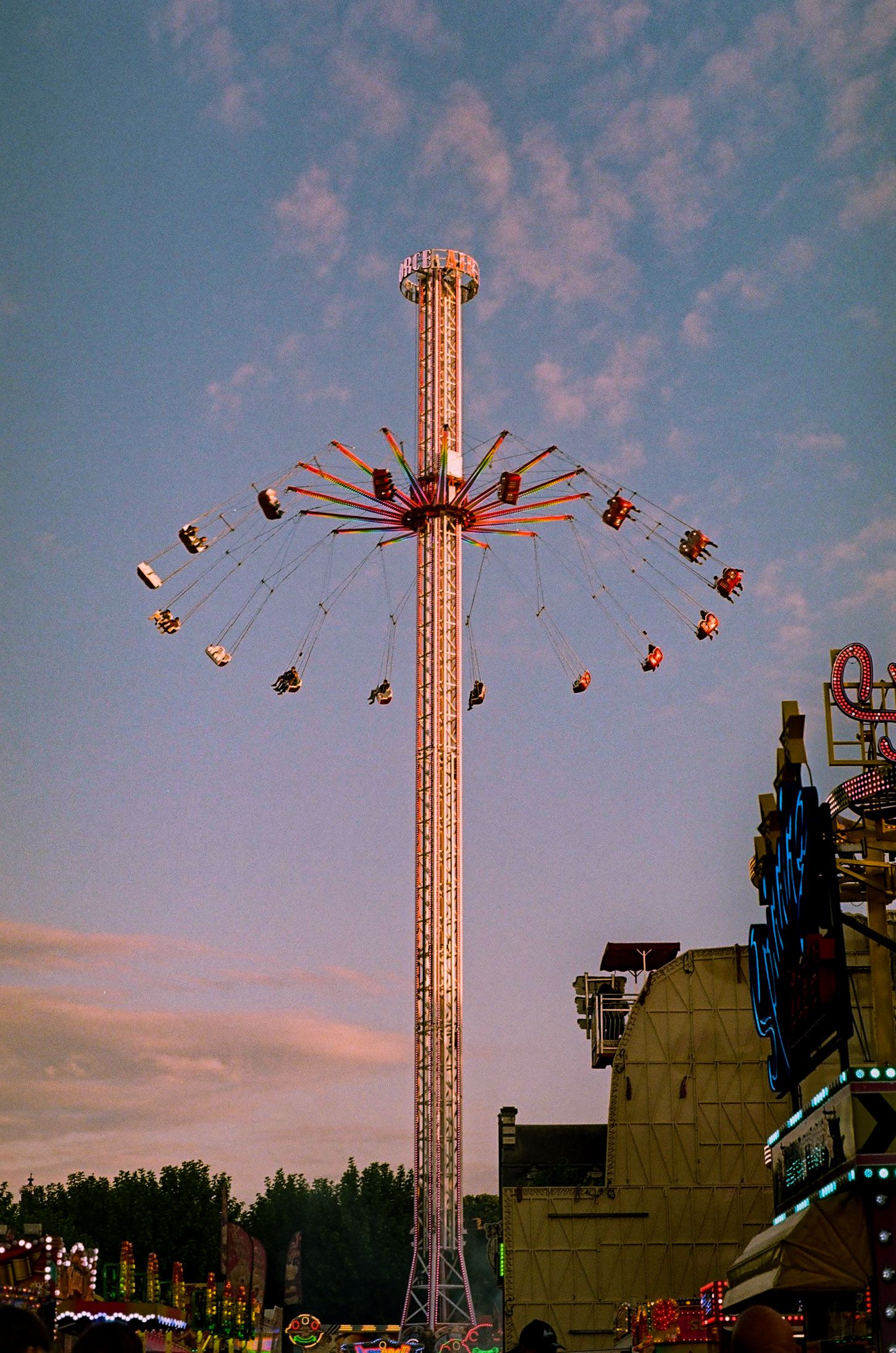 A colored 35mm film of a chair swing at a funfair