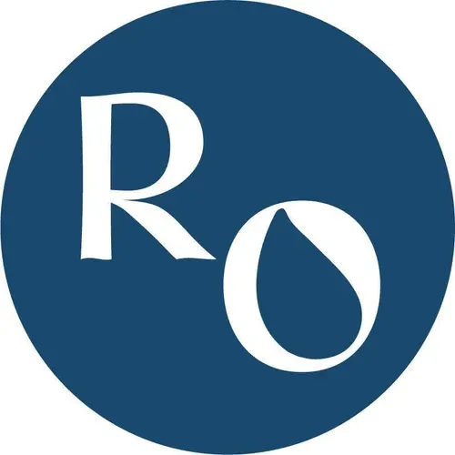 Round dark blue logo with white letters R and O representing a modern brand identity.