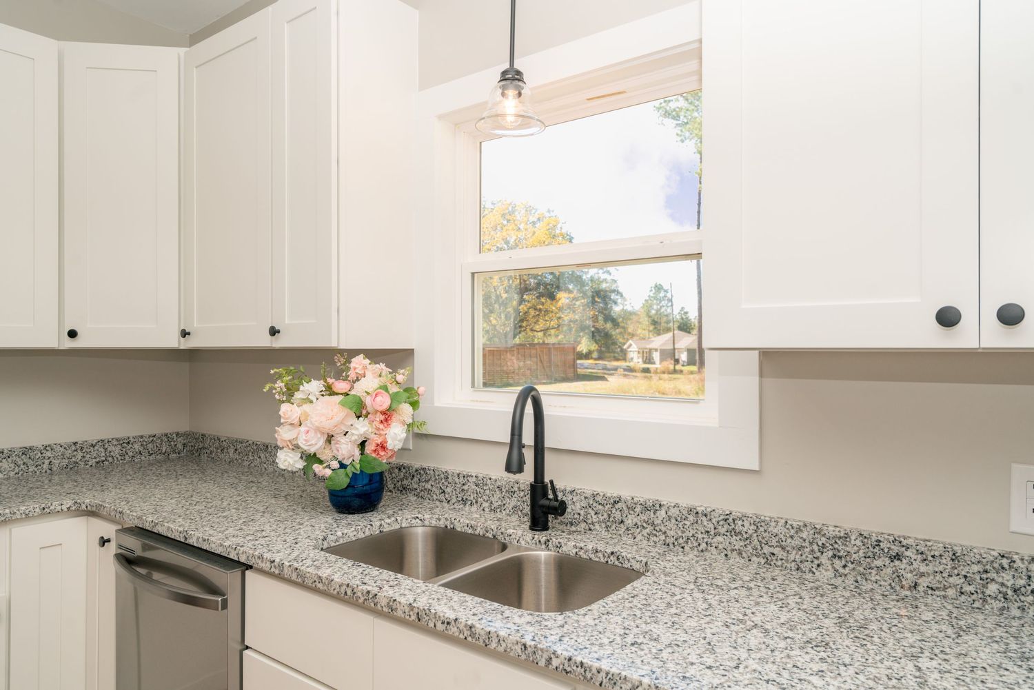 Kitchen window overlooking back yard in Newton.