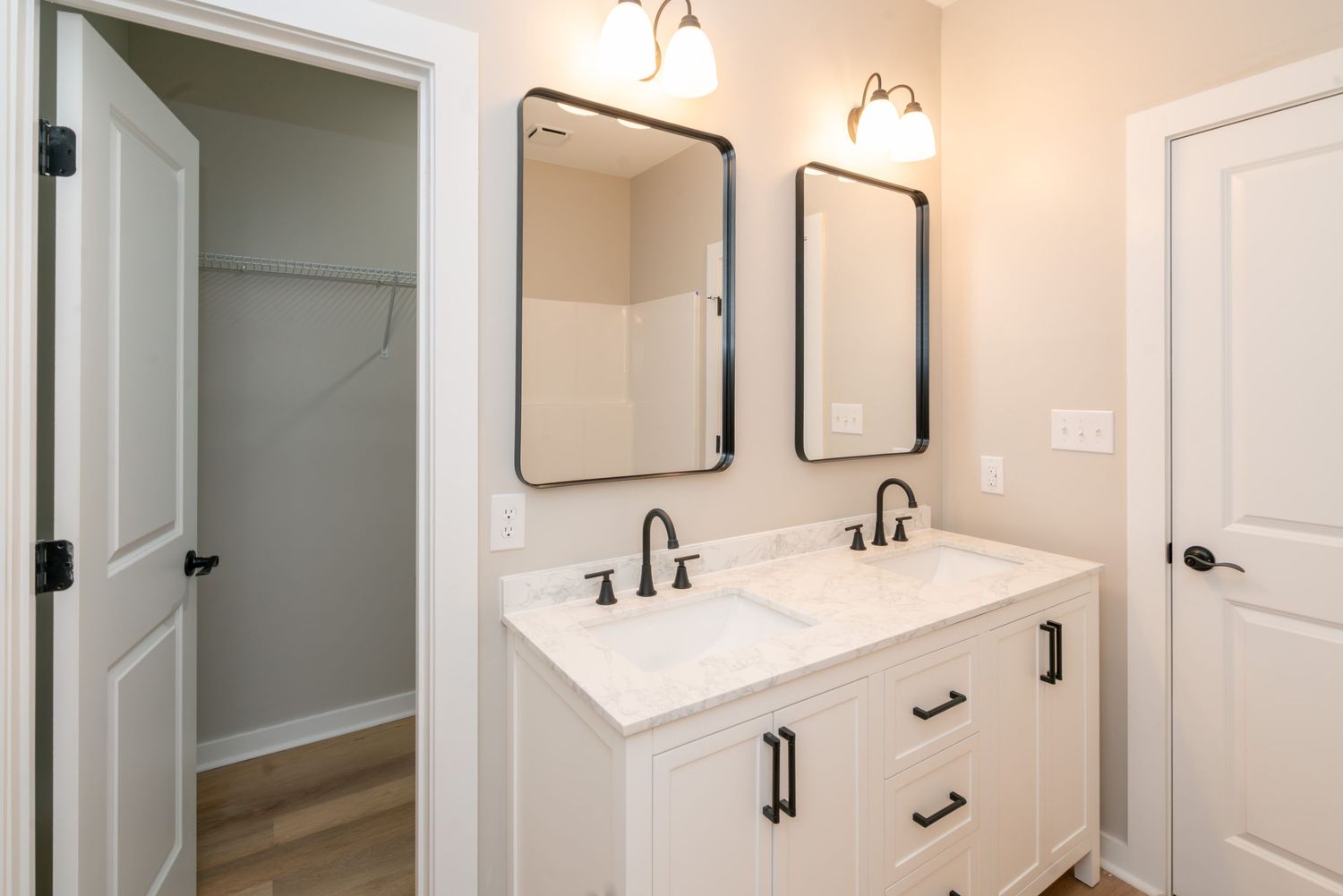 New construction house in Alabama.  Bathroom with double vanity and walk-in closet.