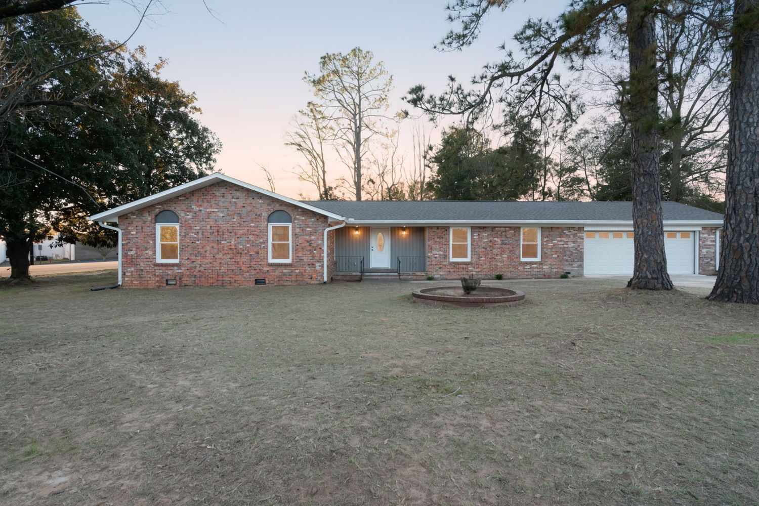 Sunset behind brick ranch style home near Lowe's in Enterprise, Alabama.