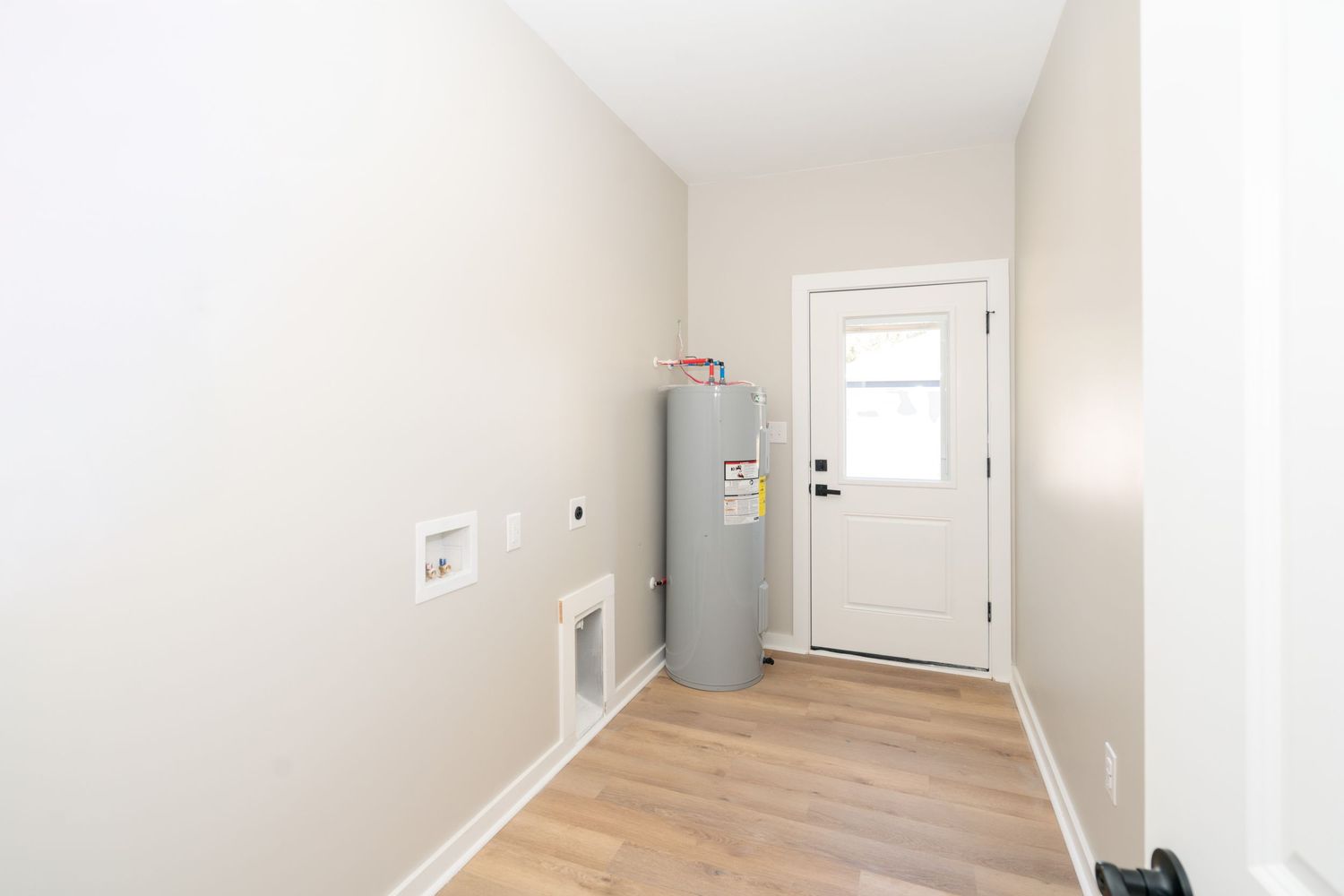 Large laundry room in new construction home in Newton.