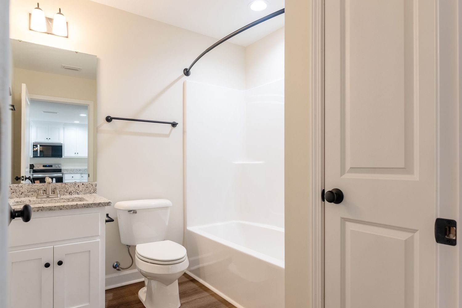 Bathroom with granite, undermount sink, and linen closet near Fort Rucker, Alabama.