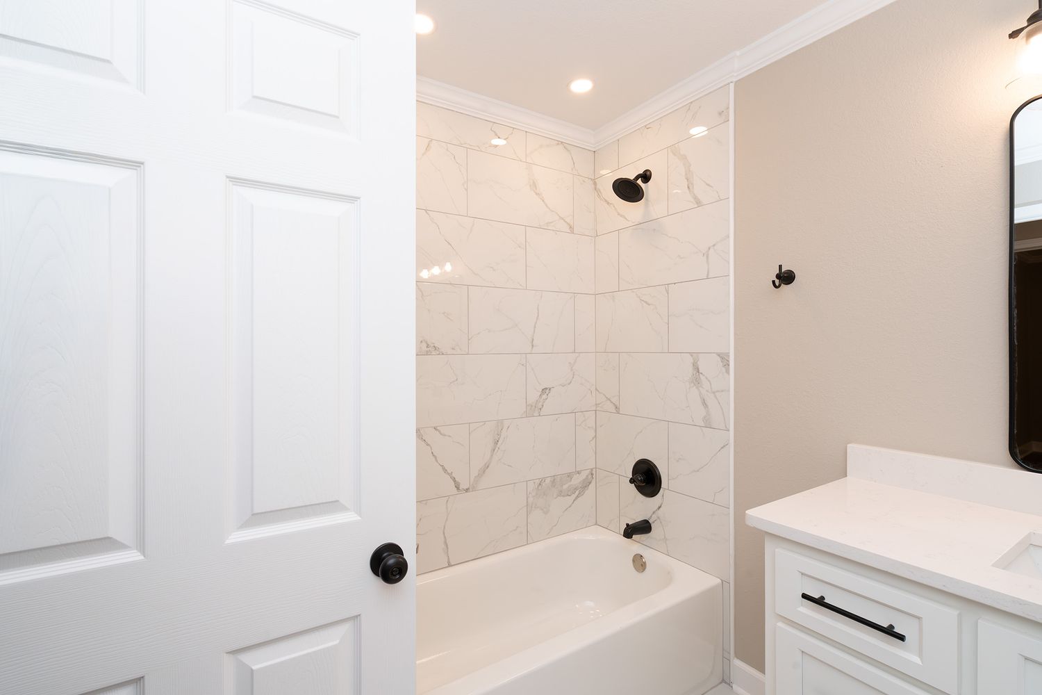 Bathroom with large tub and tiled surround near Fort Rucker.