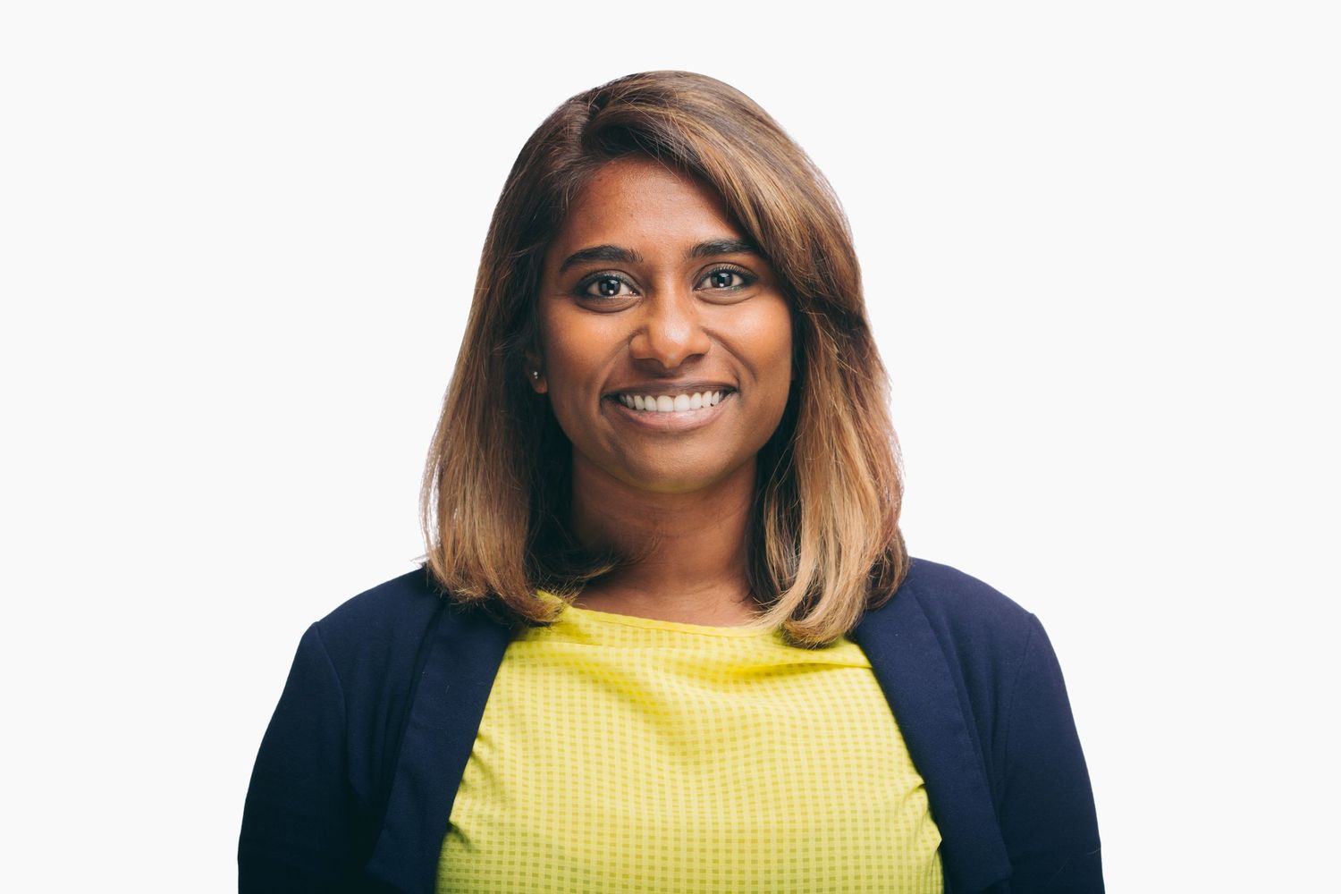 Colour photo of the photographer facing front, smiling.