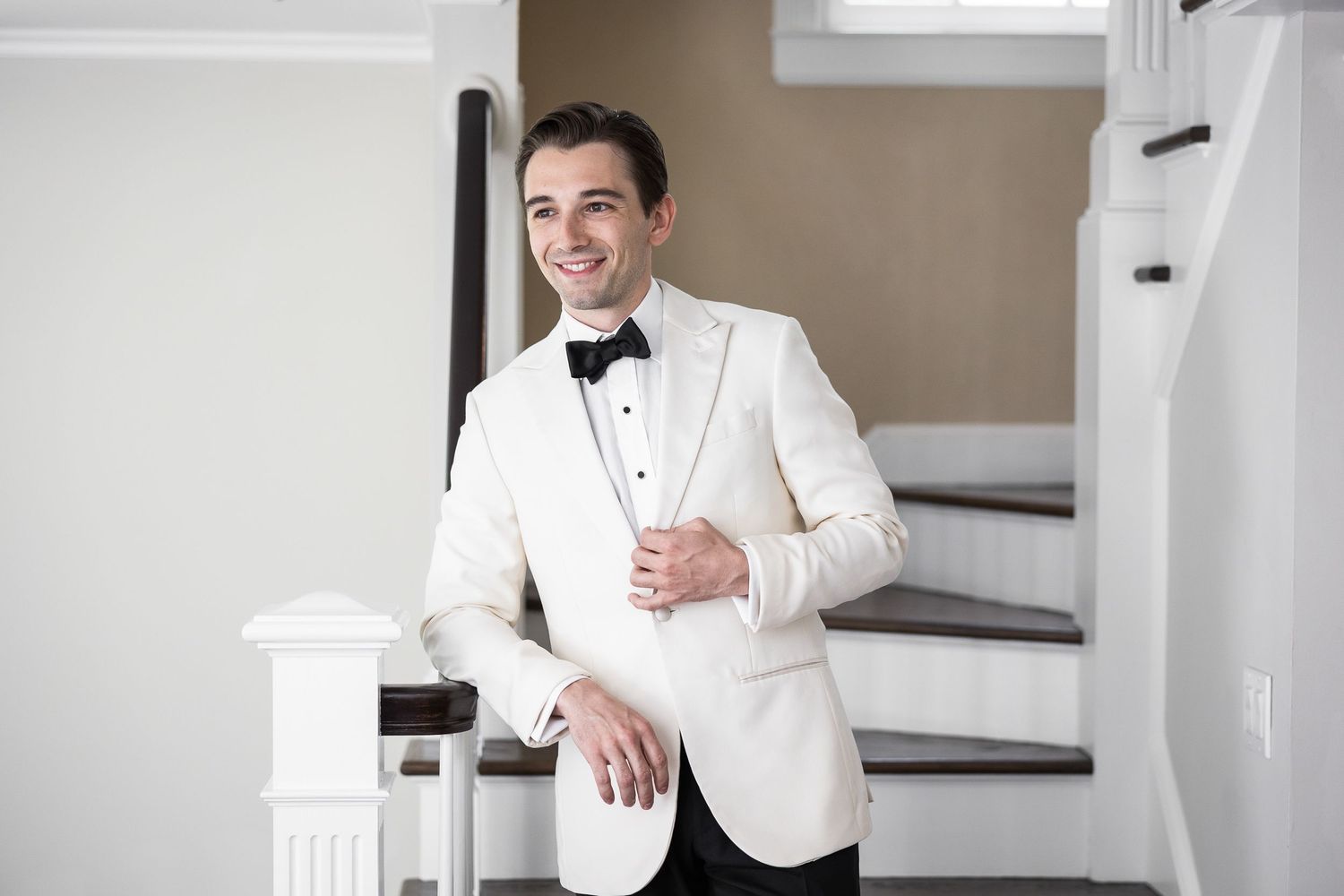 Candid moments of formal preparation in a bright interior setting.