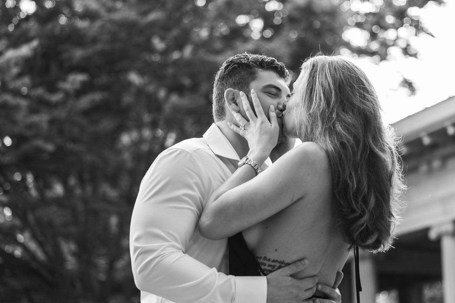 A series of black and white photographs showing tender moments between a couple against a natural backdrop.