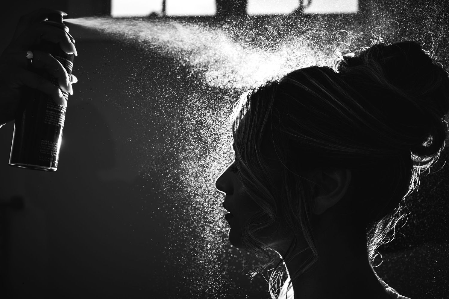Artistic black and white silhouette portraits with dramatic rim lighting.