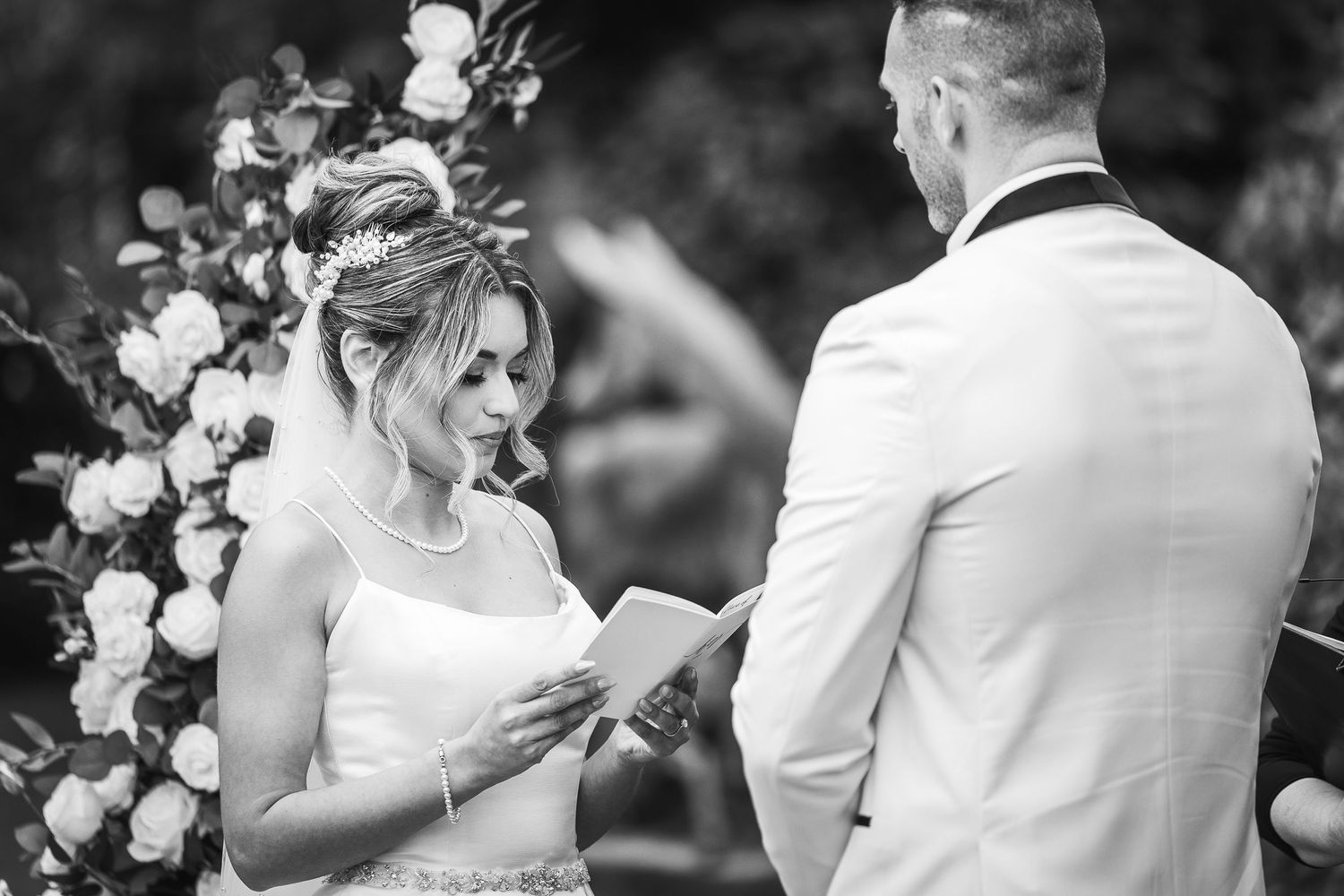Black and white candid wedding moments captured in a series of emotional expressions.
