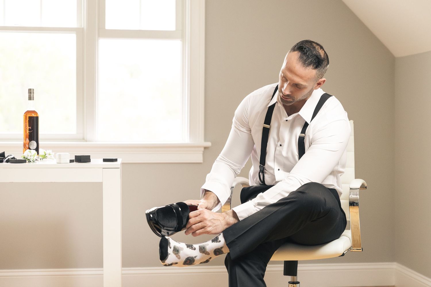 Wedding preparation scene showing details of getting ready in a bright indoor space.