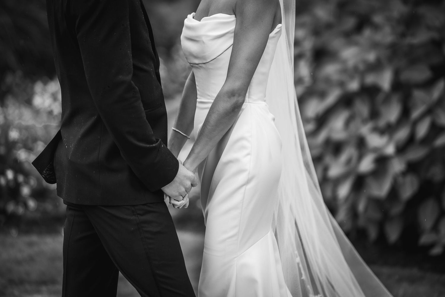 Elegant black and white photo capturing romantic wedding day moments.