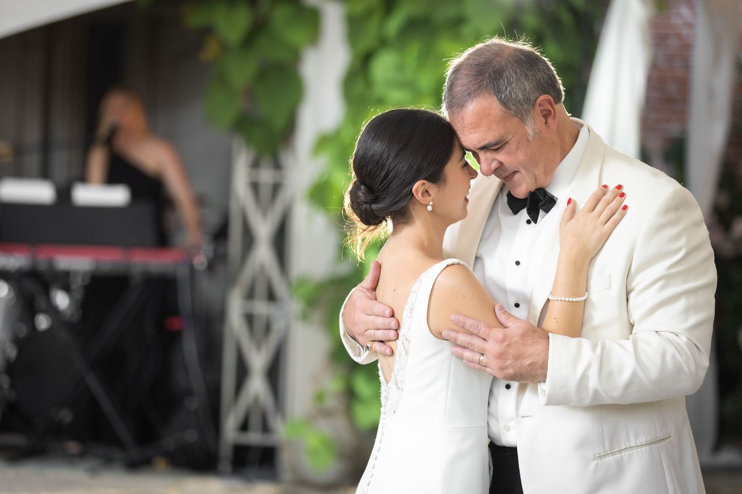 Bride and father dance at their wedding celebration.