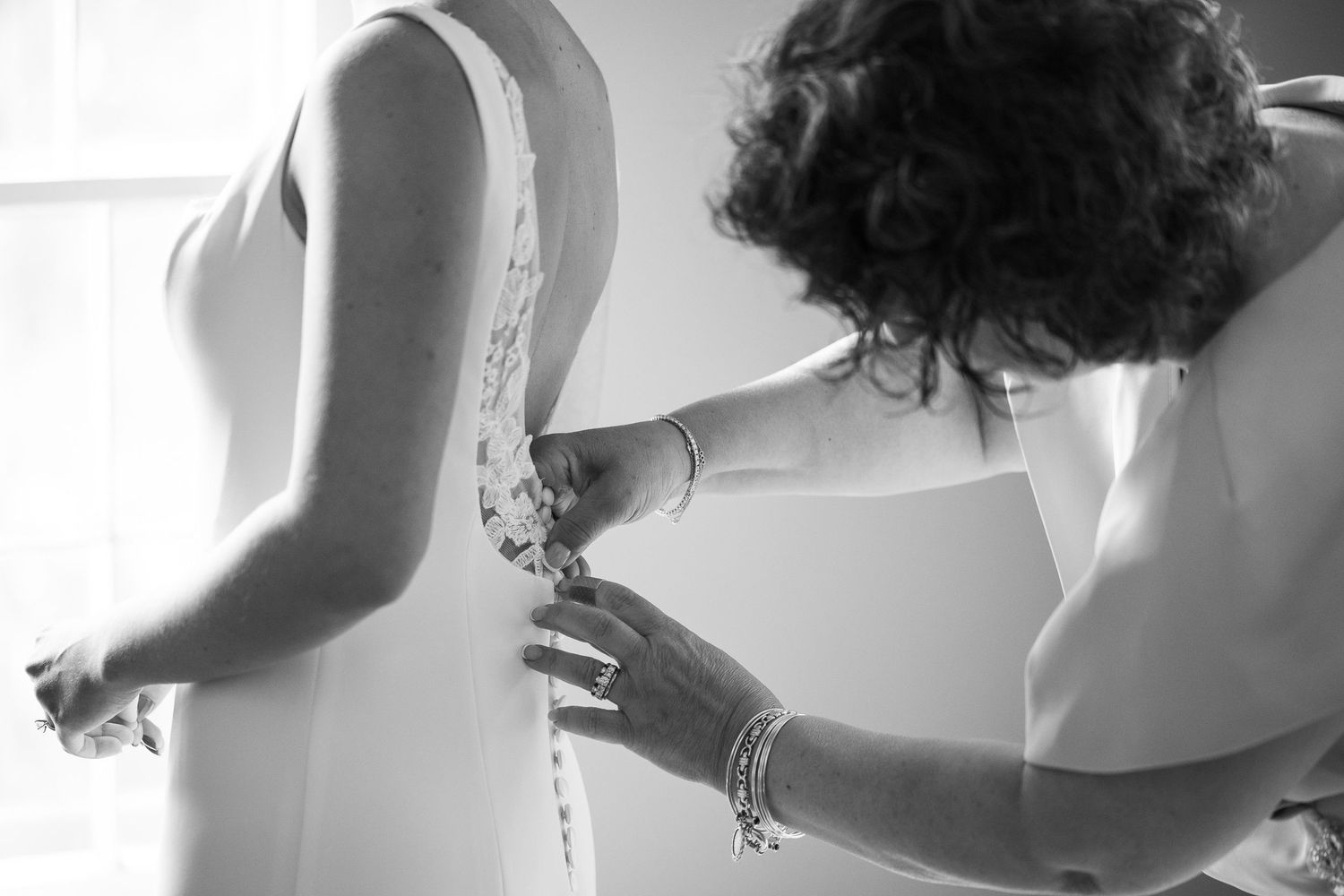 Elegant wedding day preparation details captured in soft natural light.