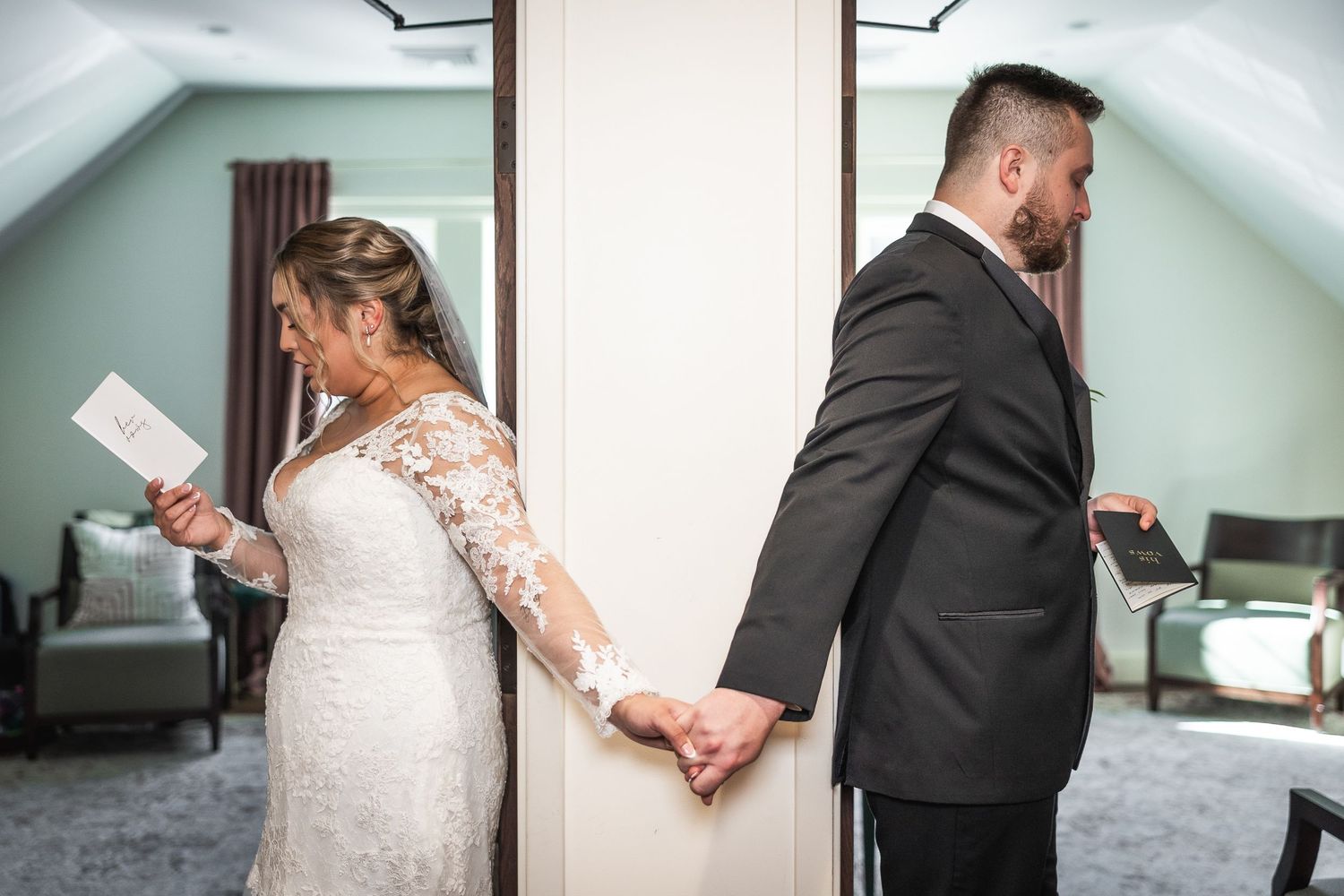 Emotional wedding moment captured as couple reads private letters to each other before their ceremony.