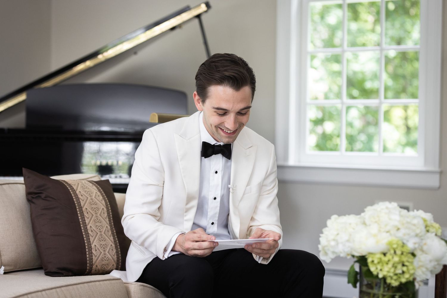 Wedding day preparation scenes with natural window lighting and formal attire.