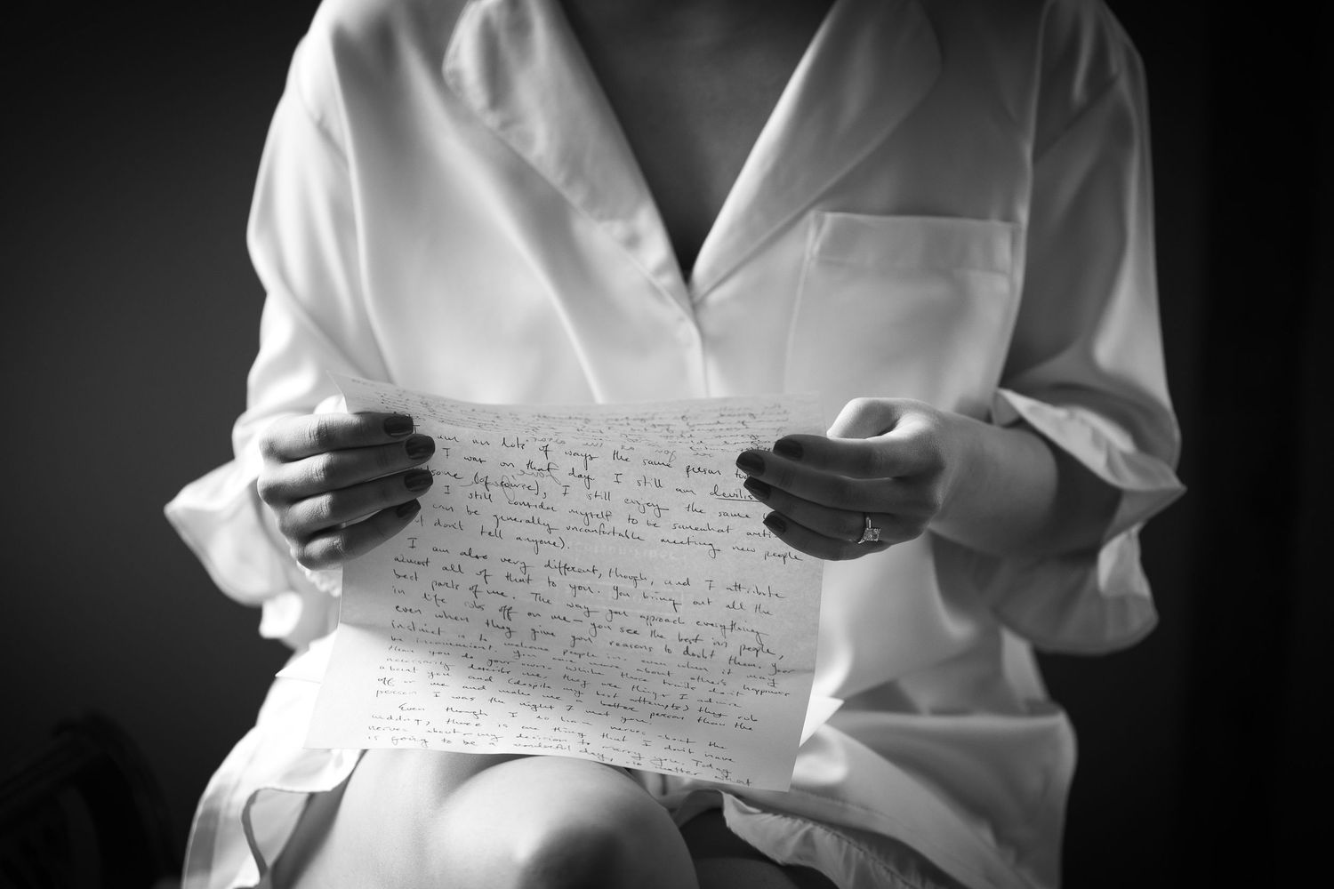 Multiple shots of someone reading handwritten letters in a white dress shirt.