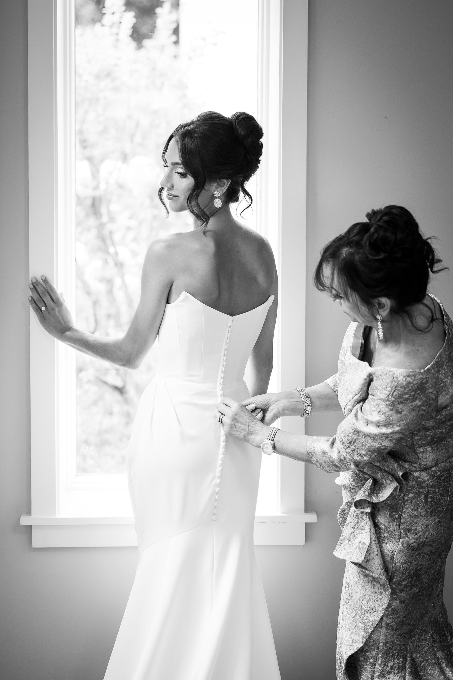 Getting ready sequence showing final dress adjustments in sunlit room.