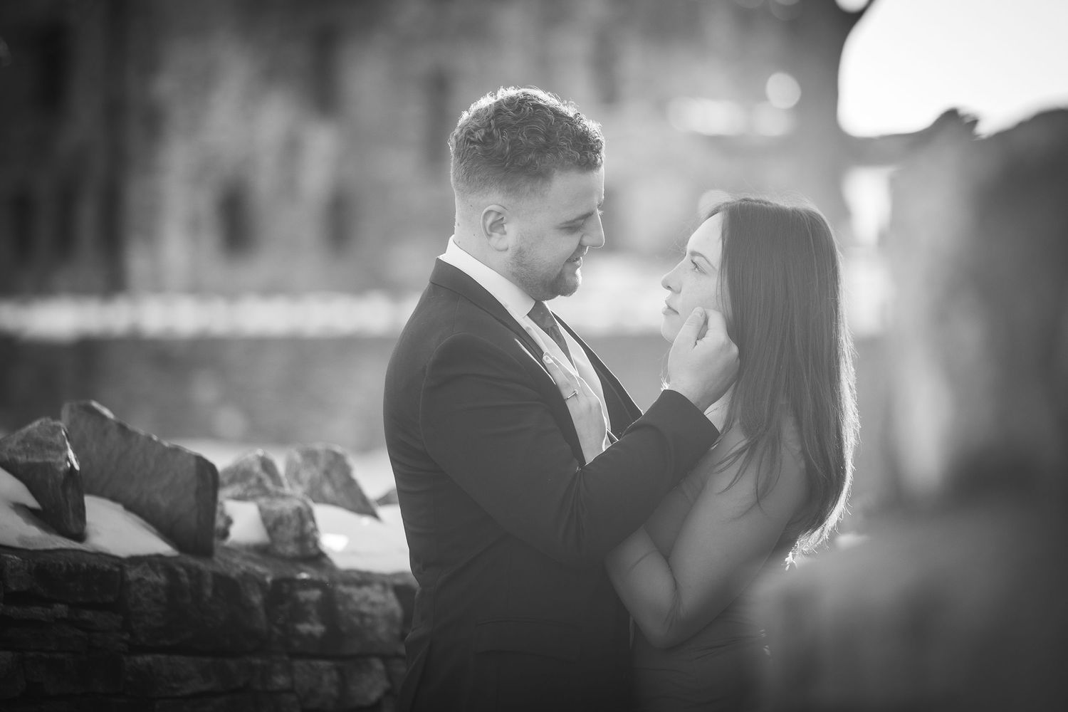 A romantic black and white photo montage of a couple dancing and embracing at a wedding reception.