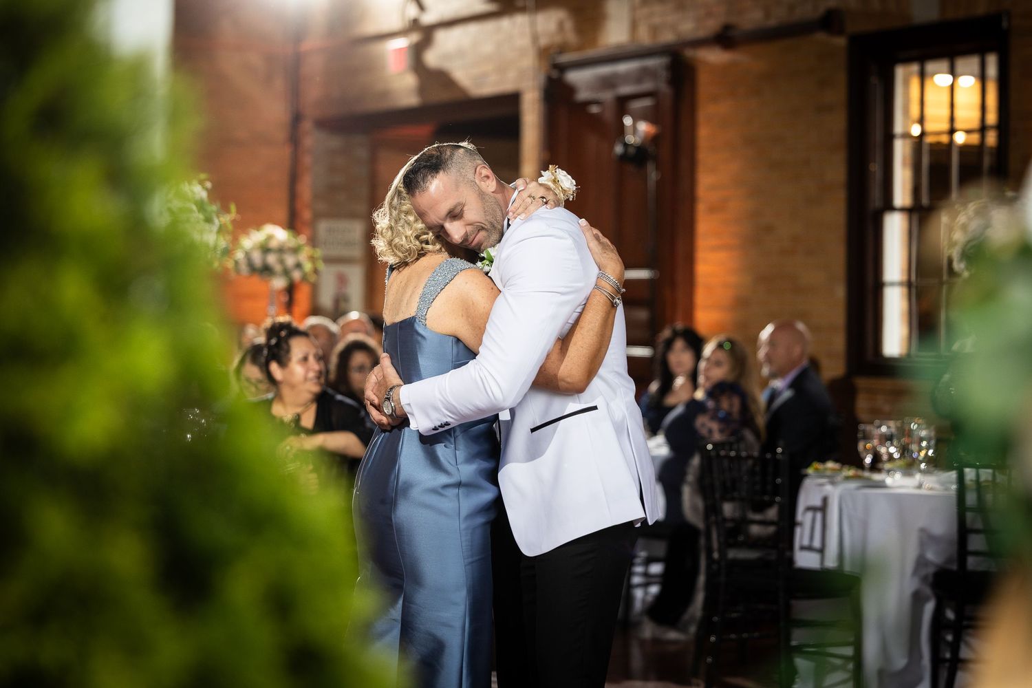 Candid moments captured during outdoor wedding reception celebrations.