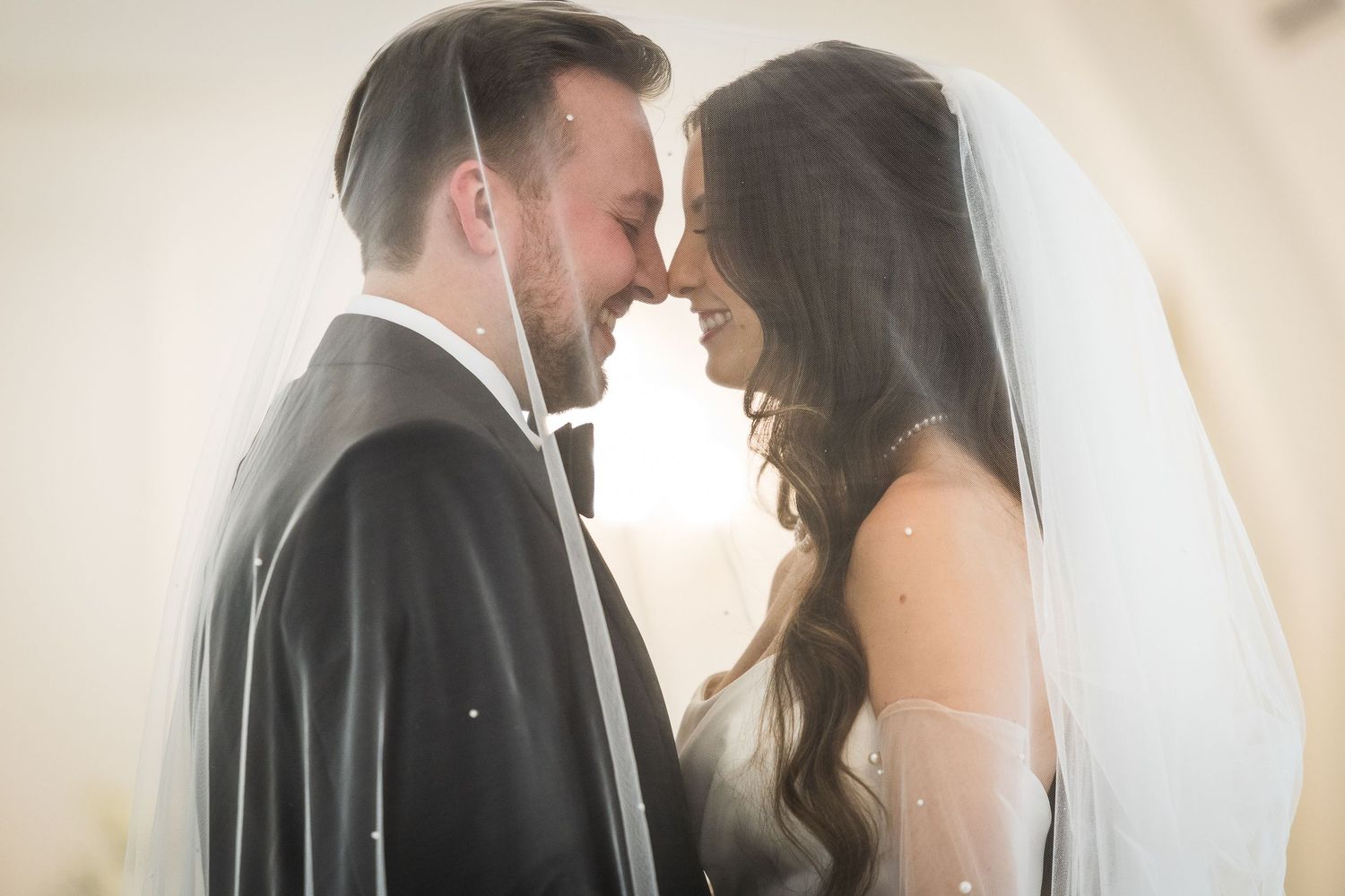 Soft focus romantic wedding portrait with dreamy natural lighting.