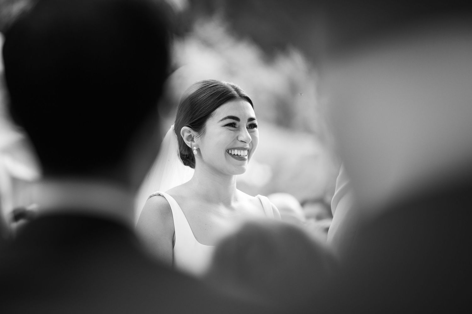 Black and white candid moments captured during wedding celebration.