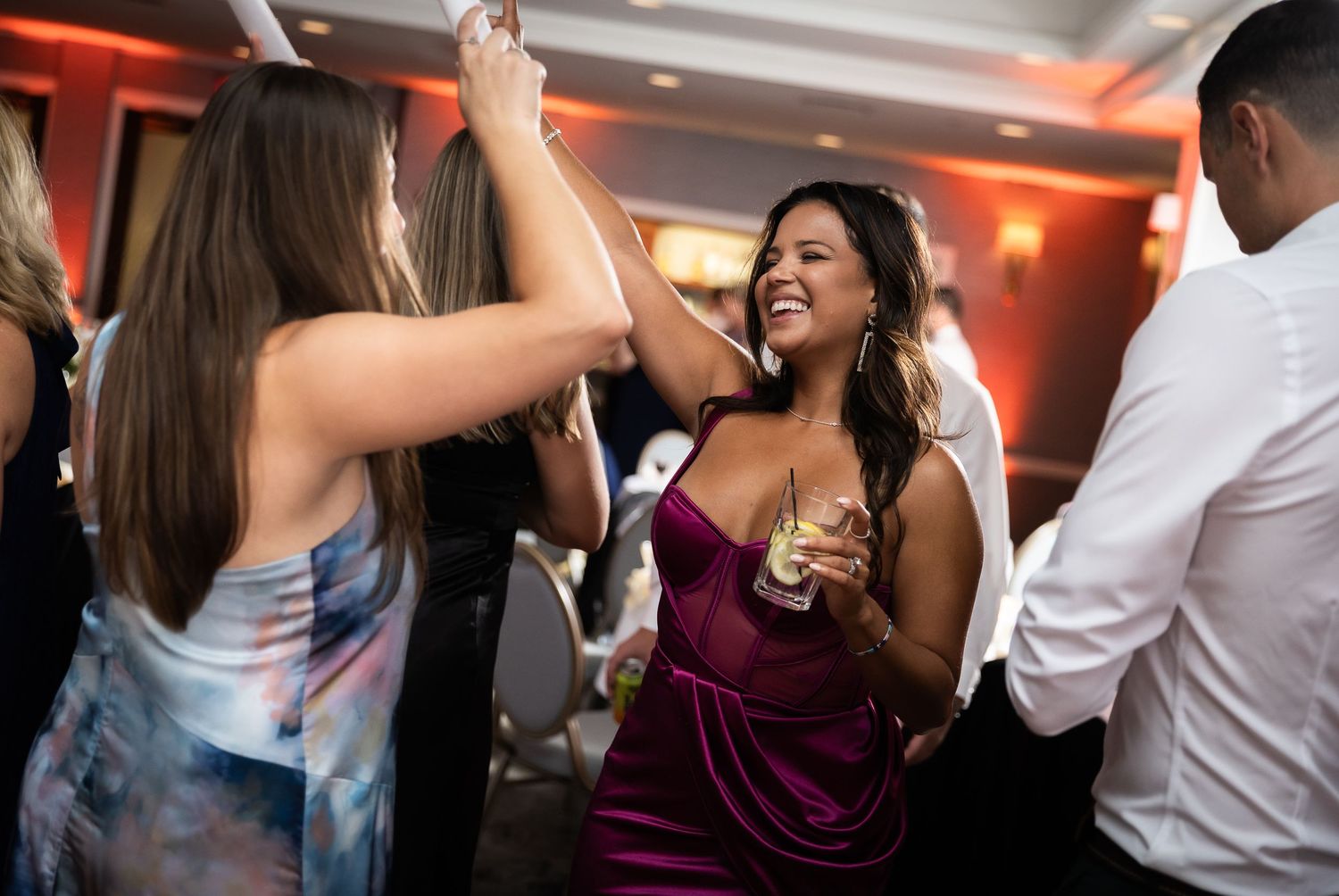 Wedding reception dance floor filled with celebrating guests.