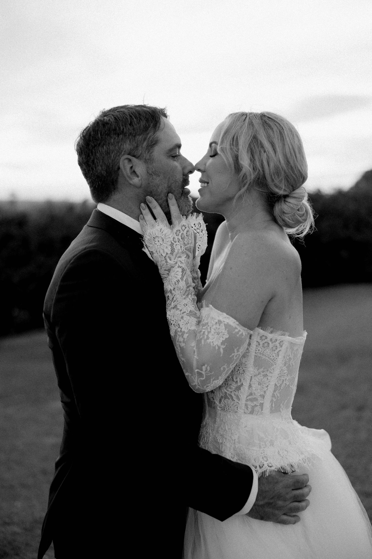 A romantic black and white photo sequence shows a couple in wedding attire sharing intimate moments in an outdoor setting.