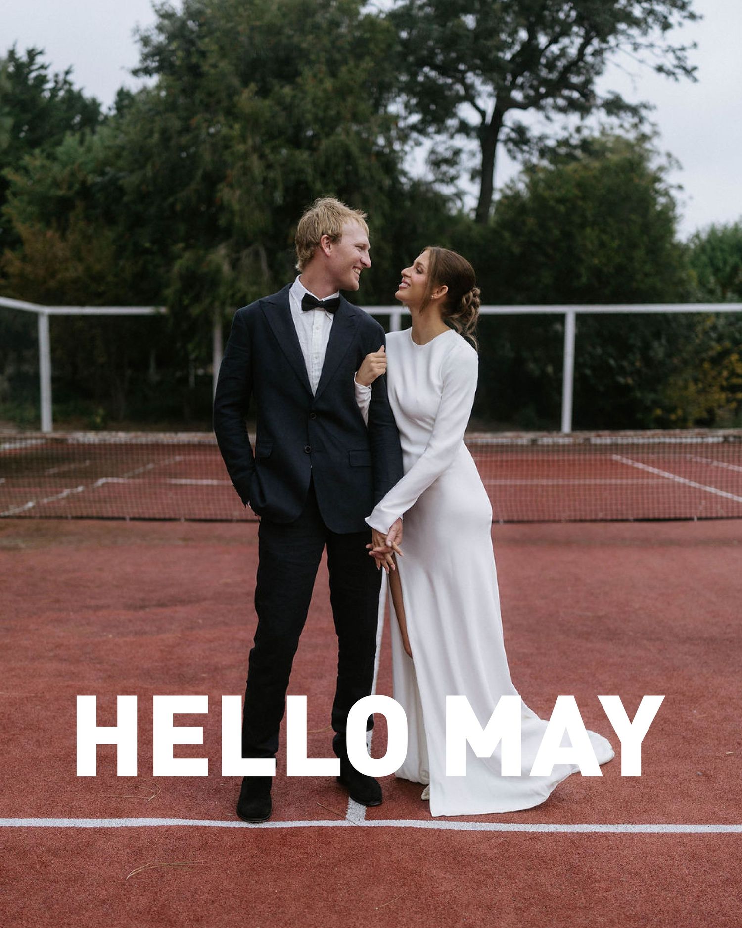 A couple in wedding attire holding hands on a tennis court, with Hello May text overlay.