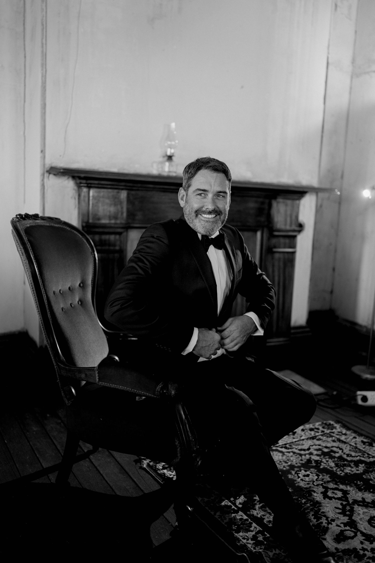 A sequence of black and white photos showing a person sitting in an ornate chair, captured from different angles.